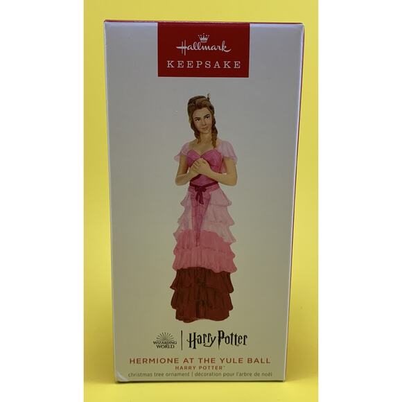 hermione yule ball dress Iconic Dresses: From the Book to the Screen Relive the Wizarding World tradition with this Christmas tree ornament featuring Hermione in her pink ball gown. Unpopular Opinion: Hermione looked better